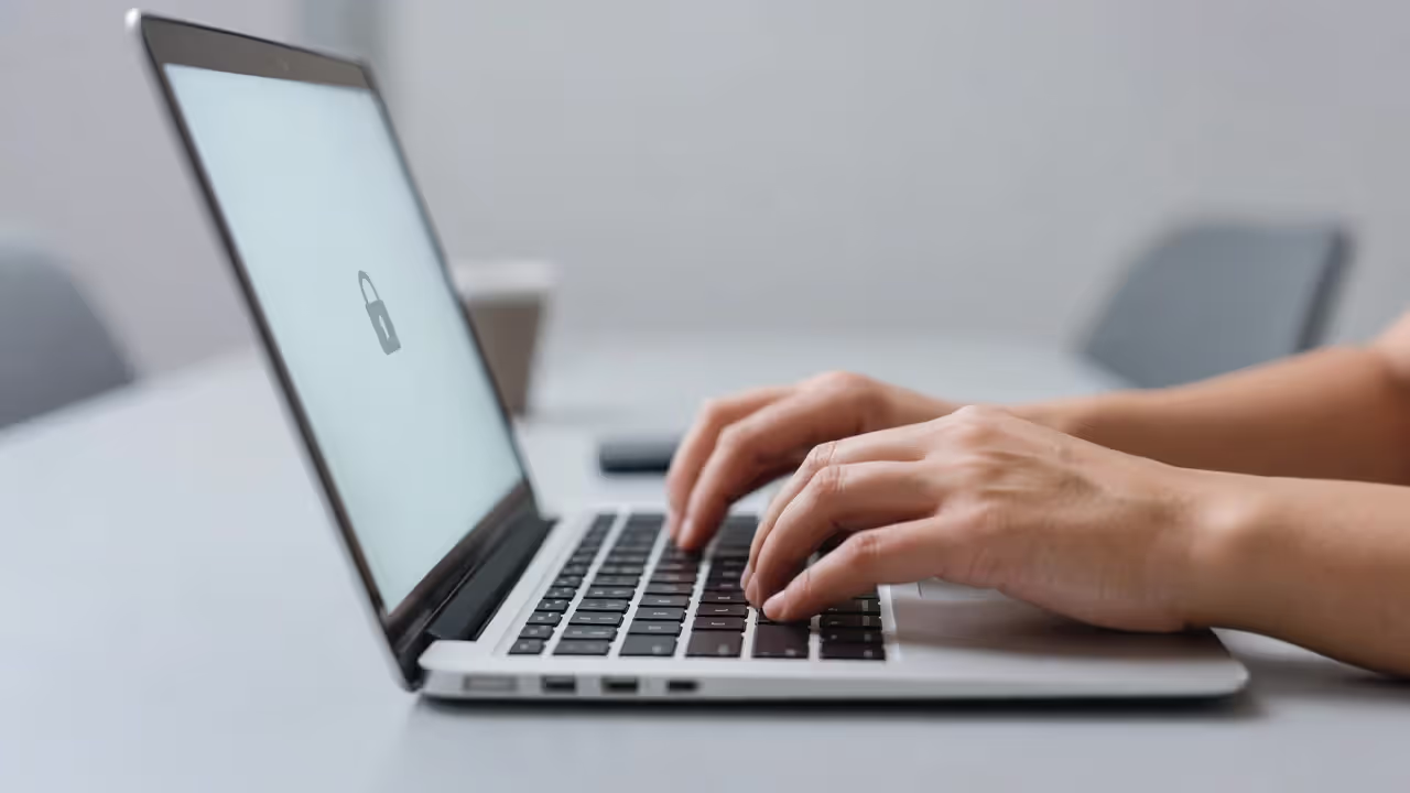 Teen using laptop safely with digital security visual